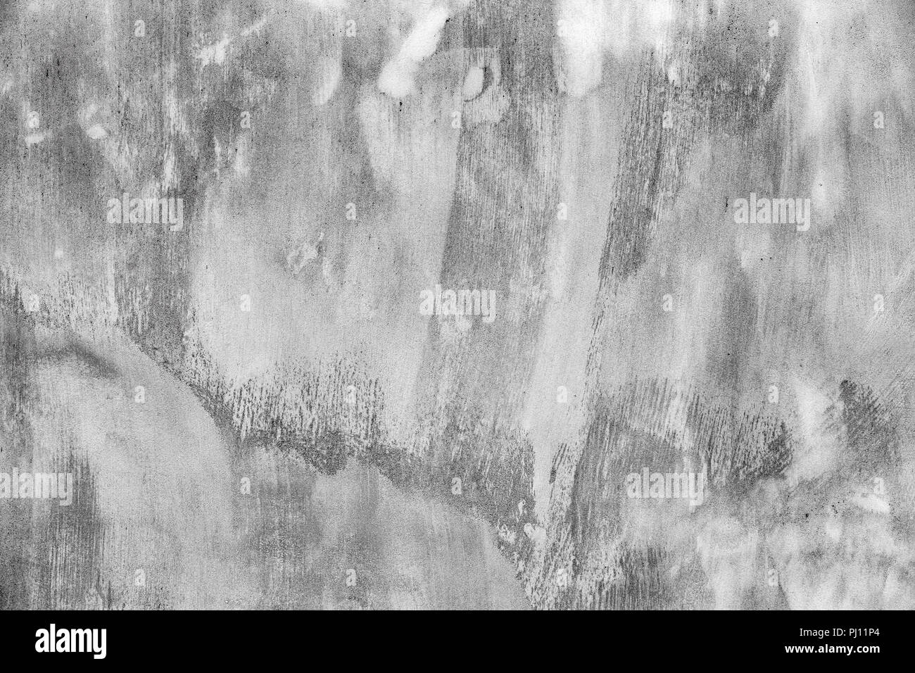Gray concrete wall with white paint brush strokes, background ...