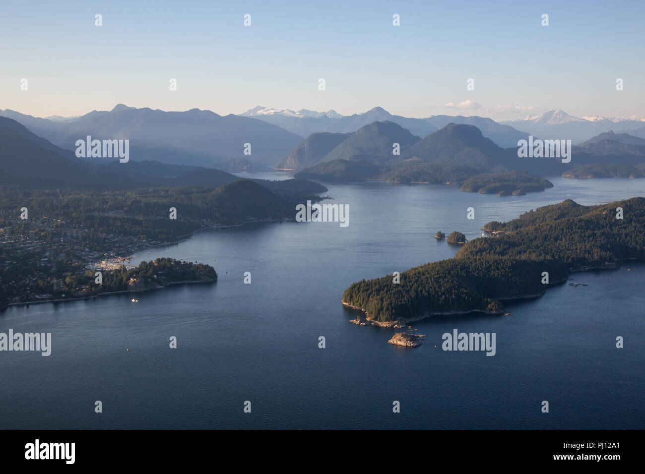 Aerial view of Gibsons, Keats Island and Howe Sound during a vibrant sunny summer day. Located