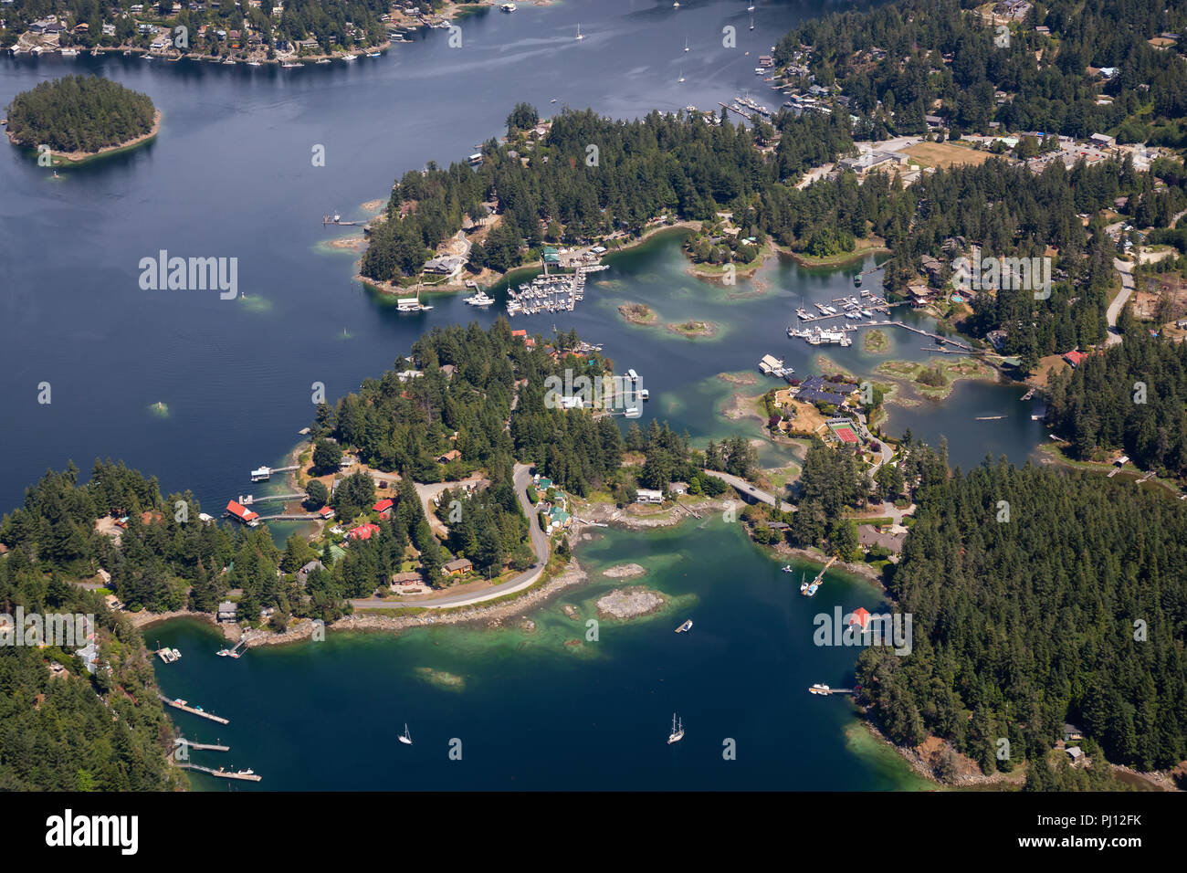 Aerial view of Madeira Park during a sunny summer day. Taken in