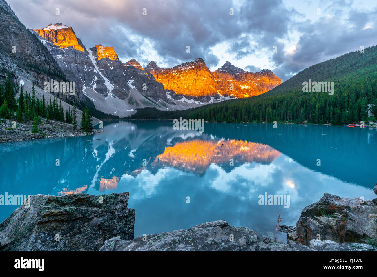 Moraine Lake glowing in the morning light, Lake Louise, Banff National Park, Alberta, Canada Stock Photo