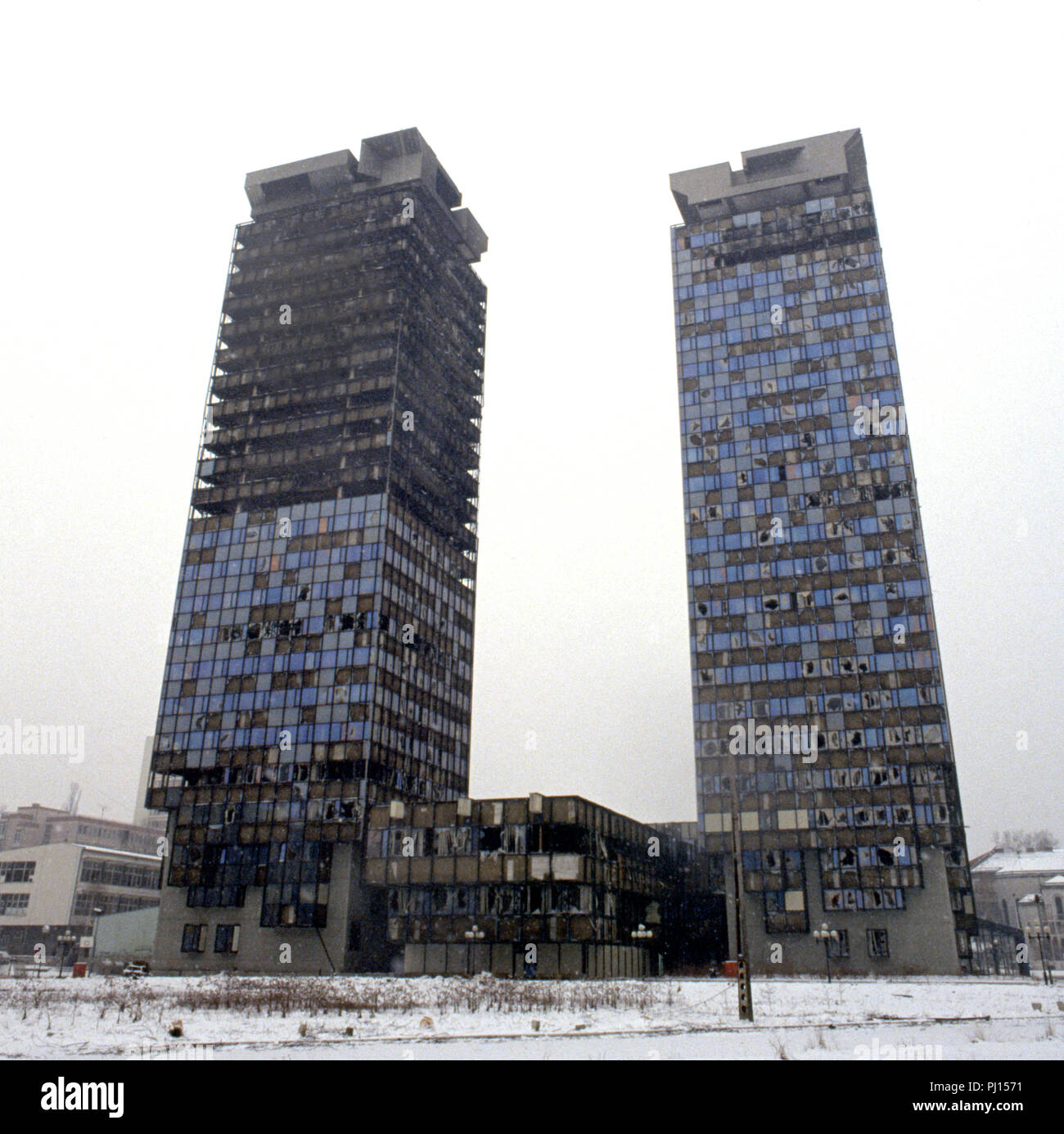 5th March 1993 During the Siege of Sarajevo: the war-damaged twin Unis Towers. They were built in the 1980s and were nicknamed 'Momo' and 'Uzeir', a Serb and a Bosniak, after characters in a radio comedy. Stock Photo