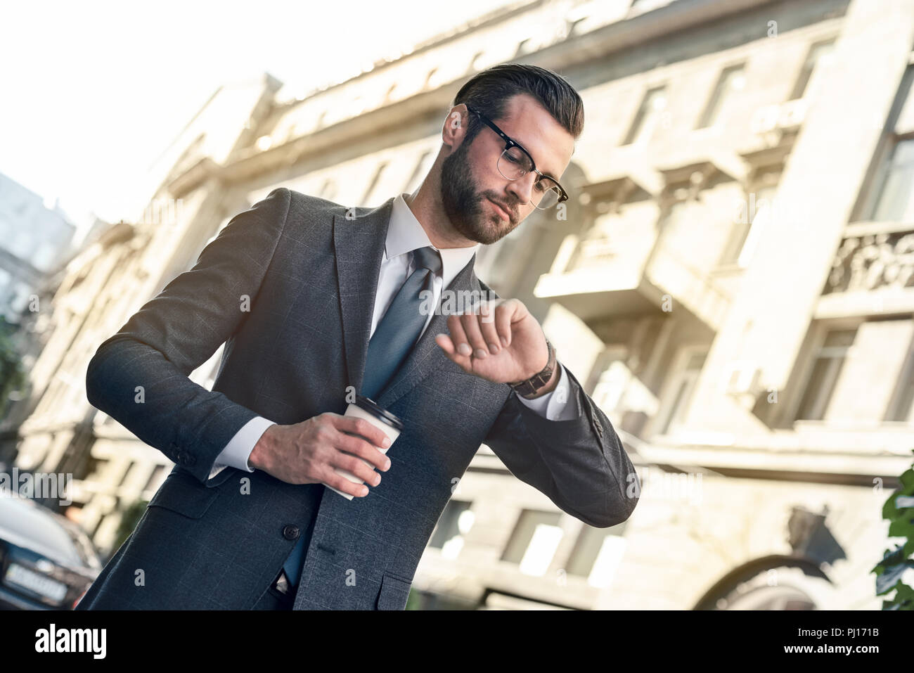 Man Checking Checking the time hi-res stock photography and images - Alamy