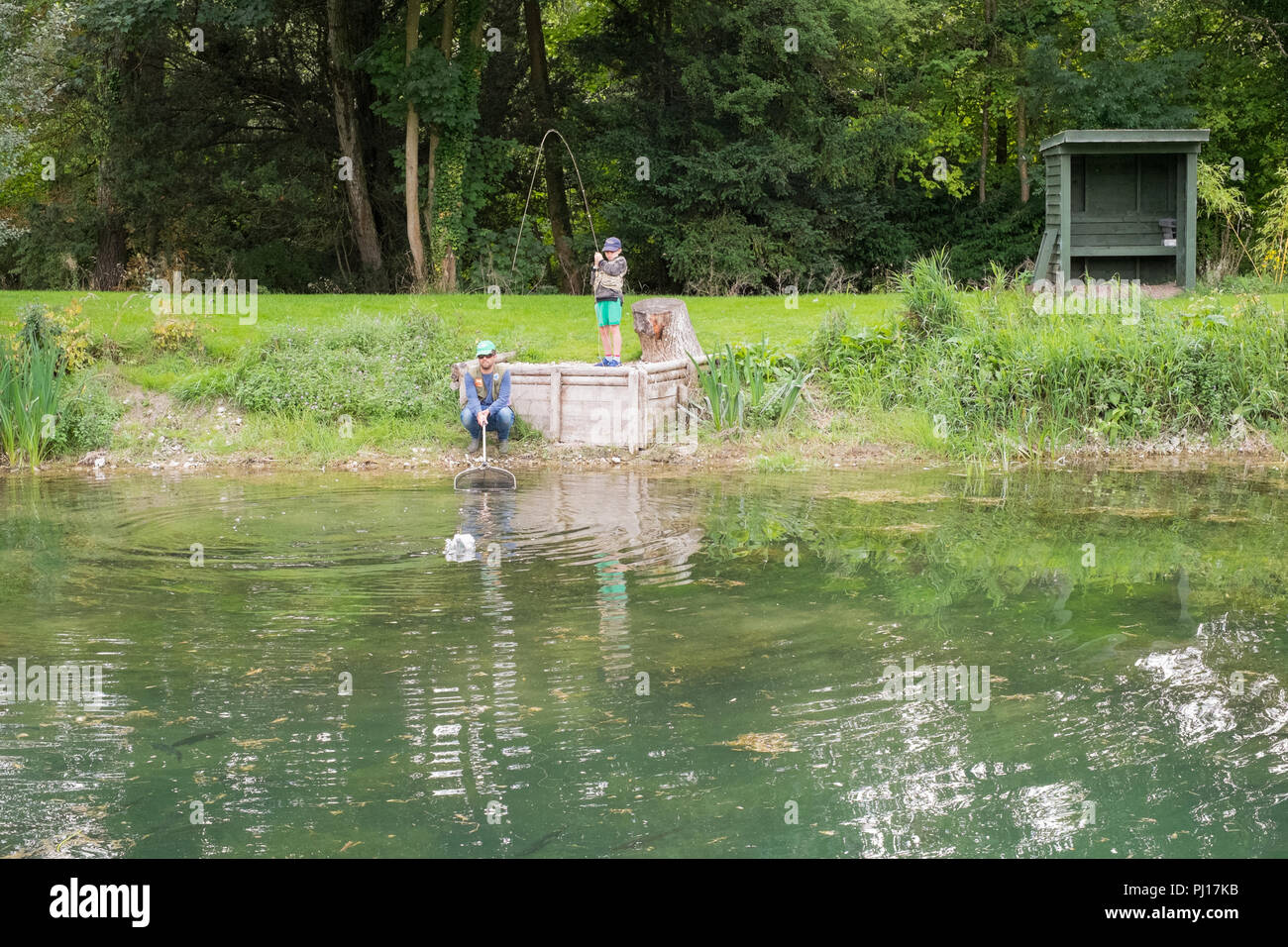 Nine year old boy trout fishing at Church Paddock Trout Fishery