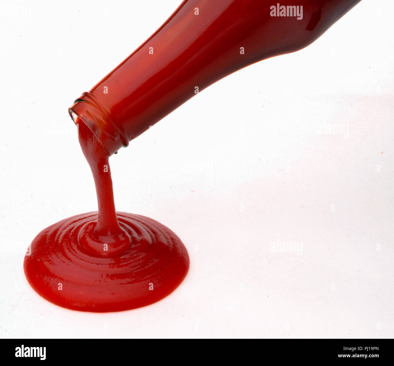 Ketchup is running out of a bottle Stock Photo Alamy