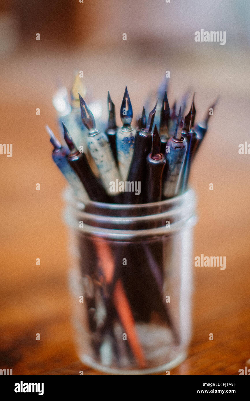 Ink pens in a glass pot Stock Photo