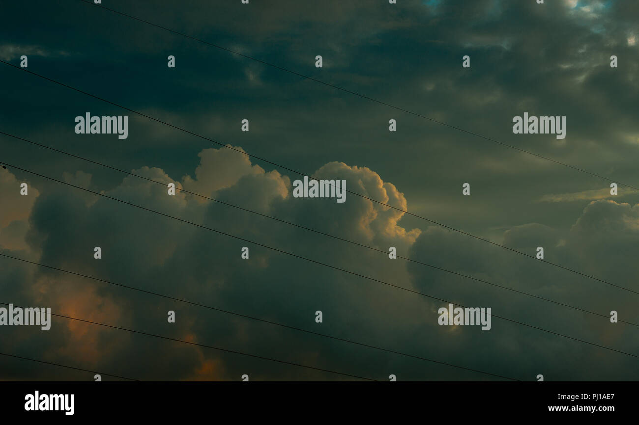 Power lines against a cloudy sky, Russia Stock Photo - Alamy