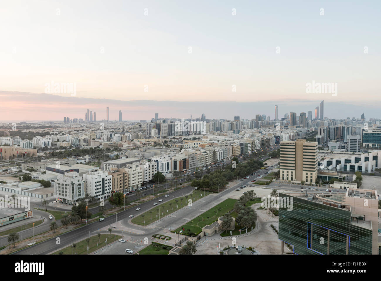 Looking towards downtown Abu Dhabi, with a view of skyscrapers and low-rise buildings, on the main Abu Dhabi Island Stock Photo