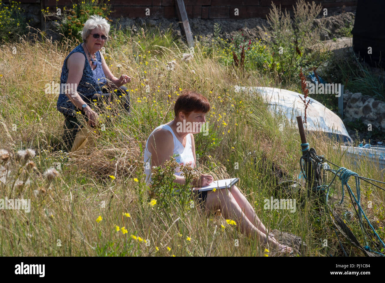 Two ladies sketching on the banks of the Tees. Stock Photo