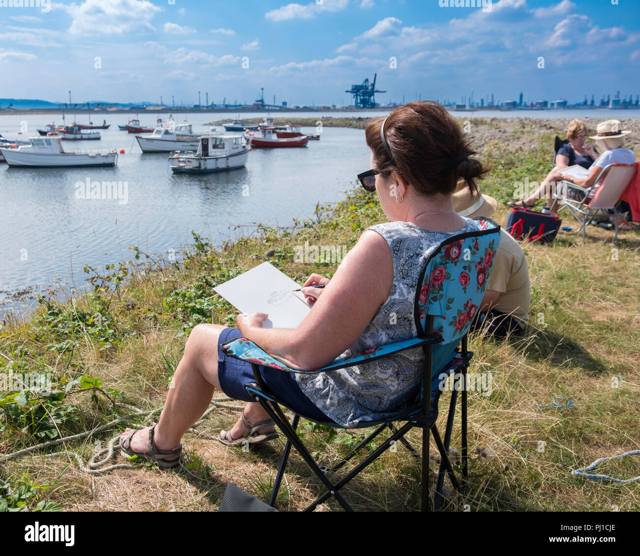 Artists sketching on the bank of the river Tees. Stock Photo