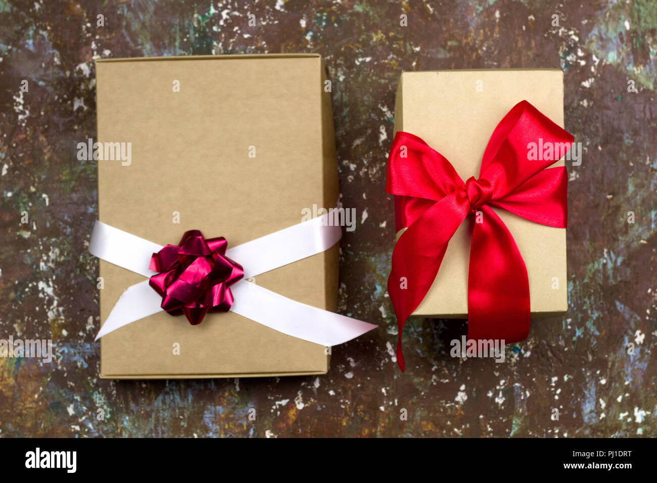 festive gift boxes brown shabby vintage background top view Stock Photo
