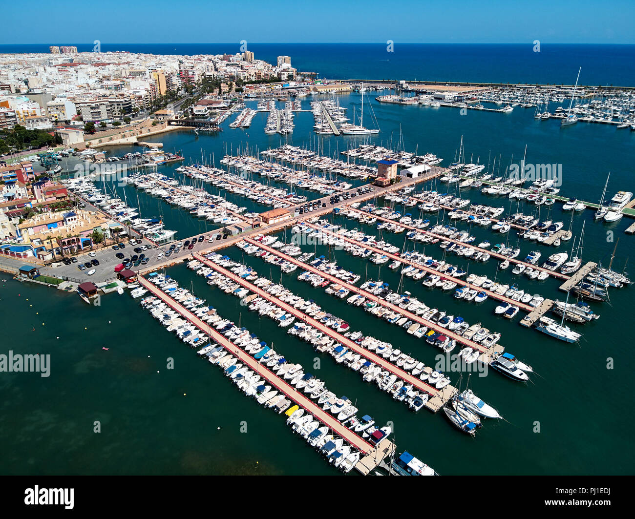 Aerial panoramic view of Torrevieja cityscape and marina port. Nautical