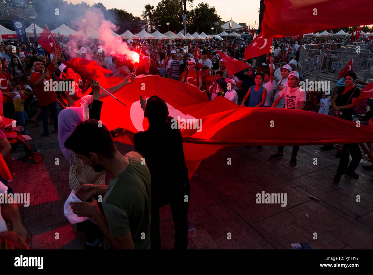 Izmir, Turkey - June 15, 2018: June 15 Day of Democracy in Turkey Izmir. People holding Turkish flags at Konak square in Izmir and in front of the his Stock Photo