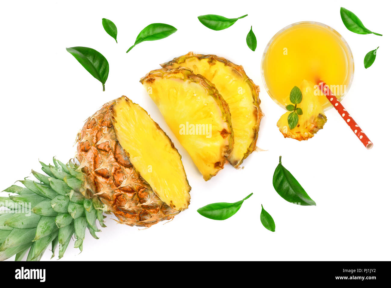 pineapple juice in a glass with with pineapple slices isolated on white ...