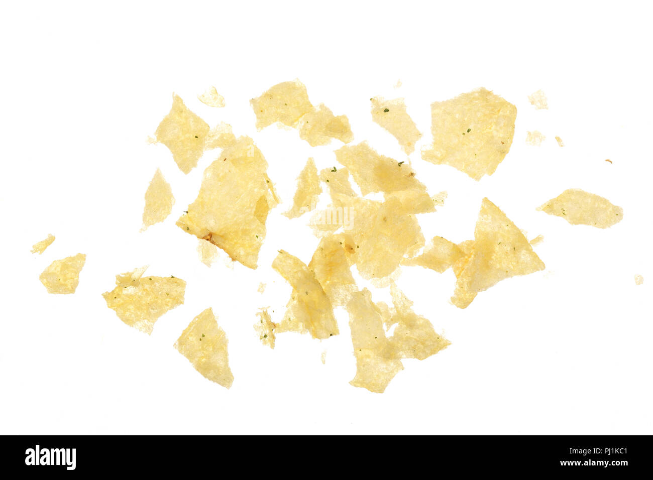 Potato chips crumbs and leftovers isolated over the white background