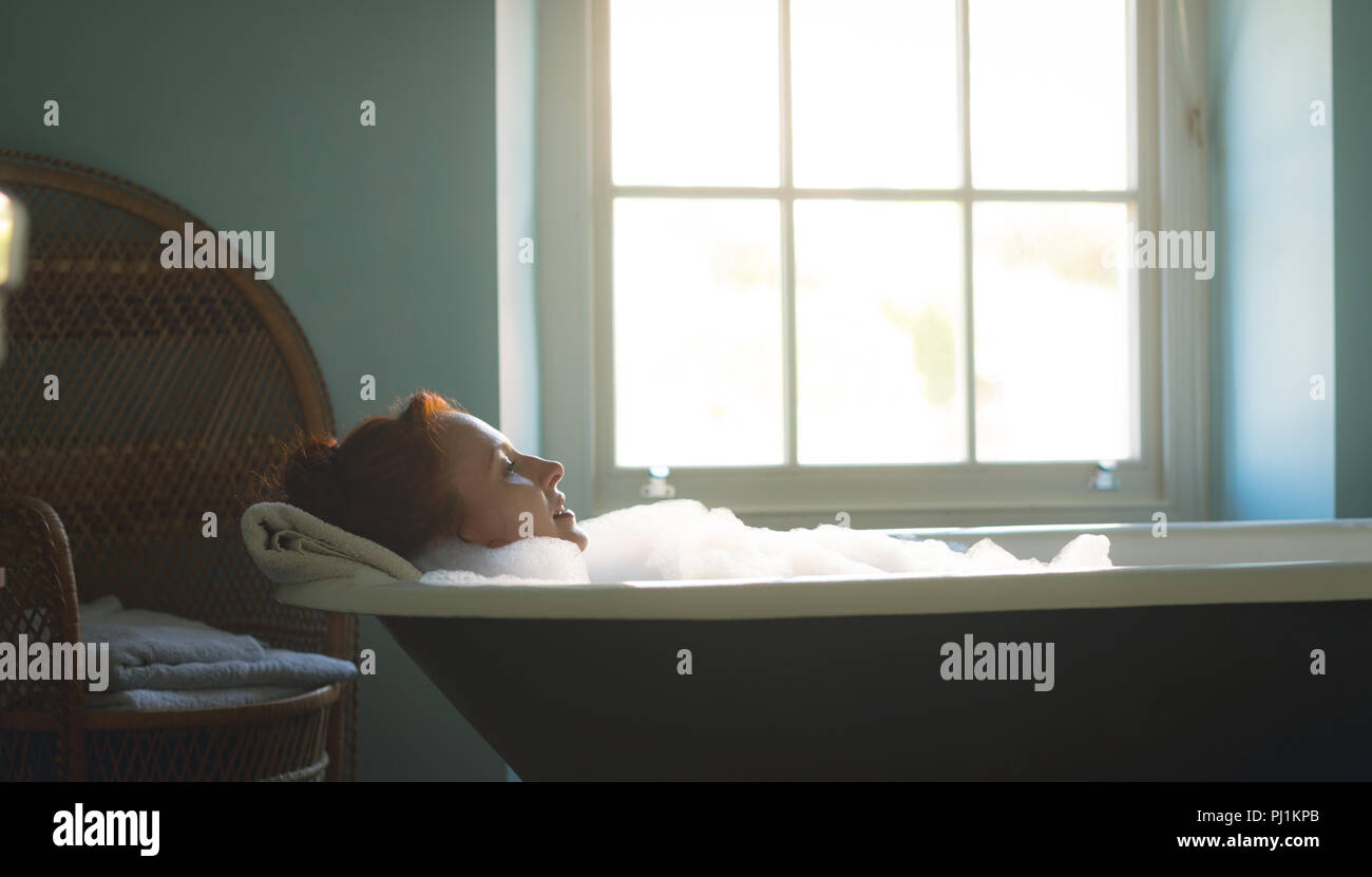 Woman taking bath in bathtub Stock Photo Alamy