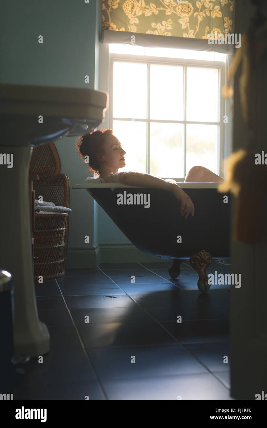 Woman taking bath in bathtub Stock Photo Alamy