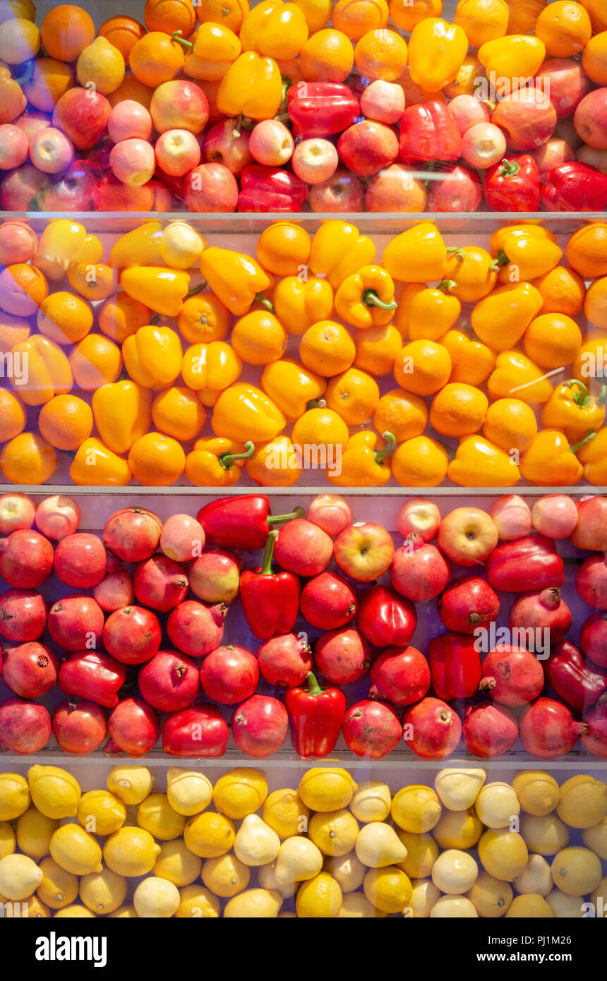 various yellow and red fruits wall background Stock Photo