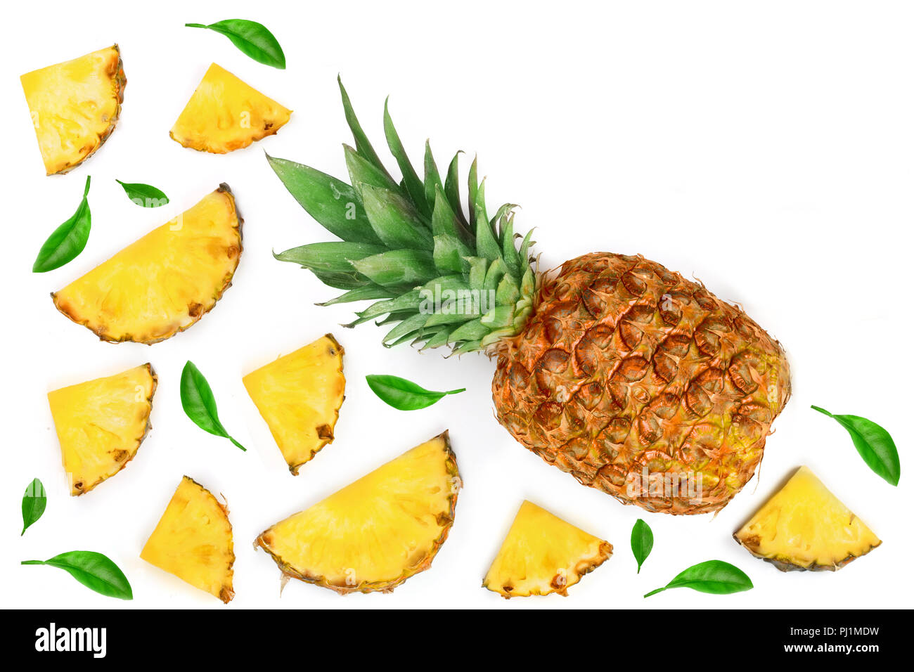 Sliced pineapple decorated with green leaves isolated on white ...