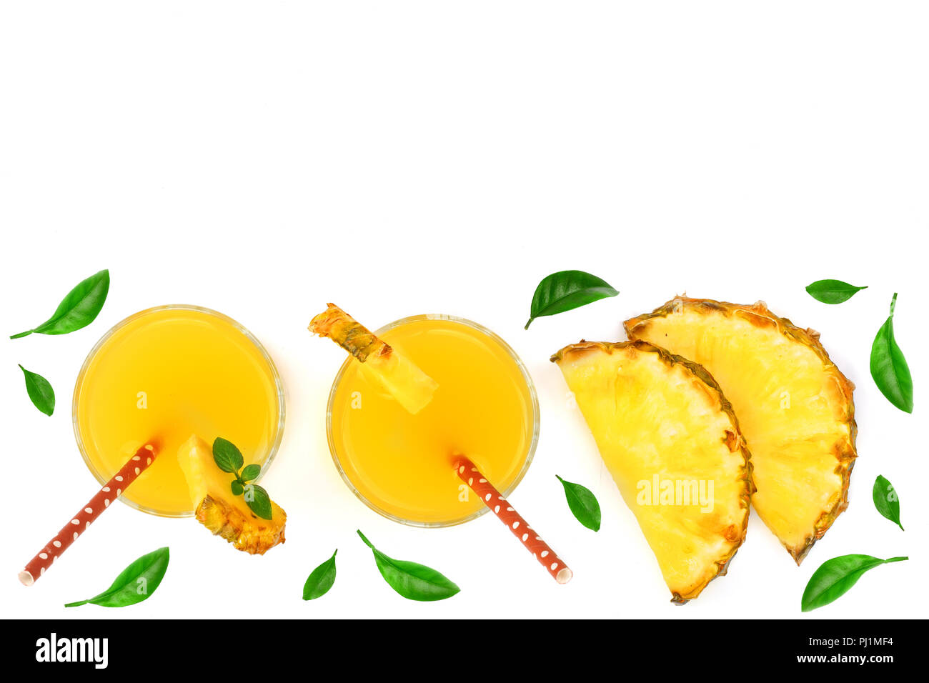 pineapple juice in a glass and pineapple slices decorated with green ...