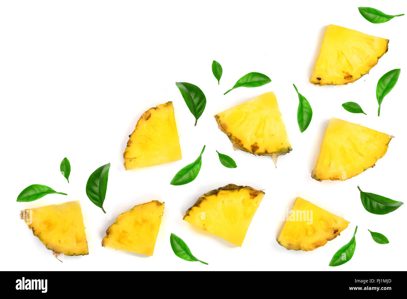 Sliced pineapple decorated with green leaves isolated on white ...