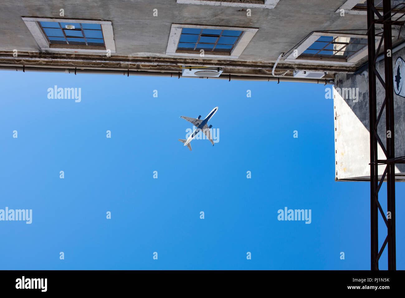 Plane in the sky Stock Photo - Alamy