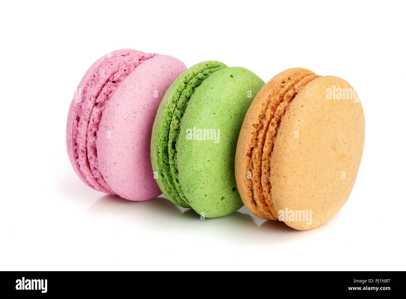 colorful macarons isolated on white background closeup. Stock Photo