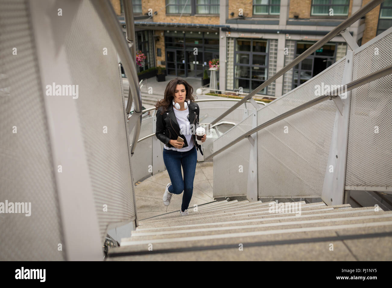 Running up stairs hi-res stock photography and images - Alamy
