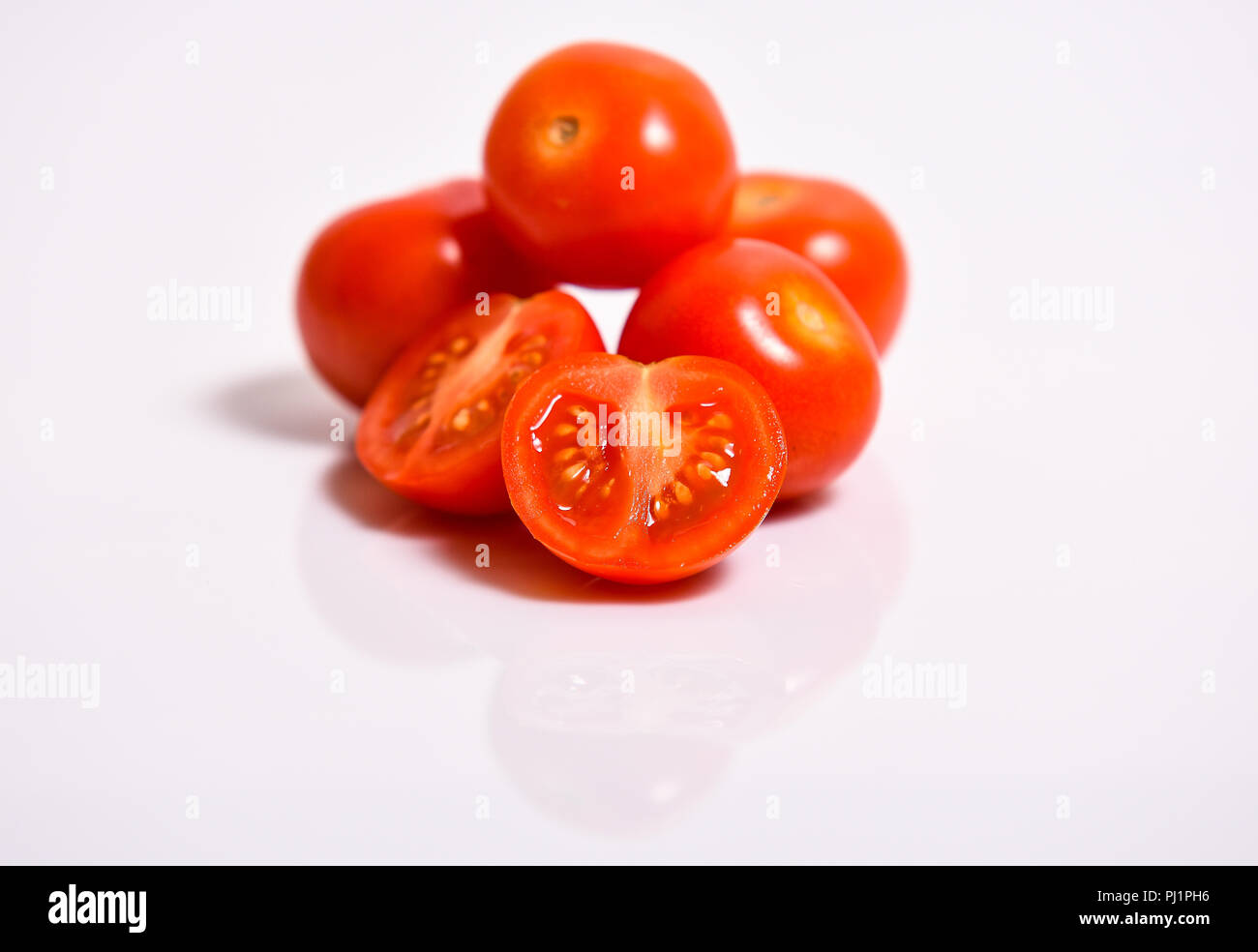 Cherry tomatoes isolated on white background Stock Photo - Alamy