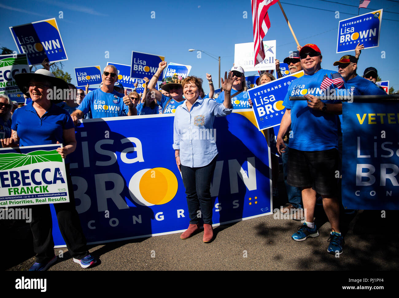 Lisa Brown, a Democratic candidate running to represent Washington's 5th Congressional District, poses for a photo with her supporters before marching Stock Photo