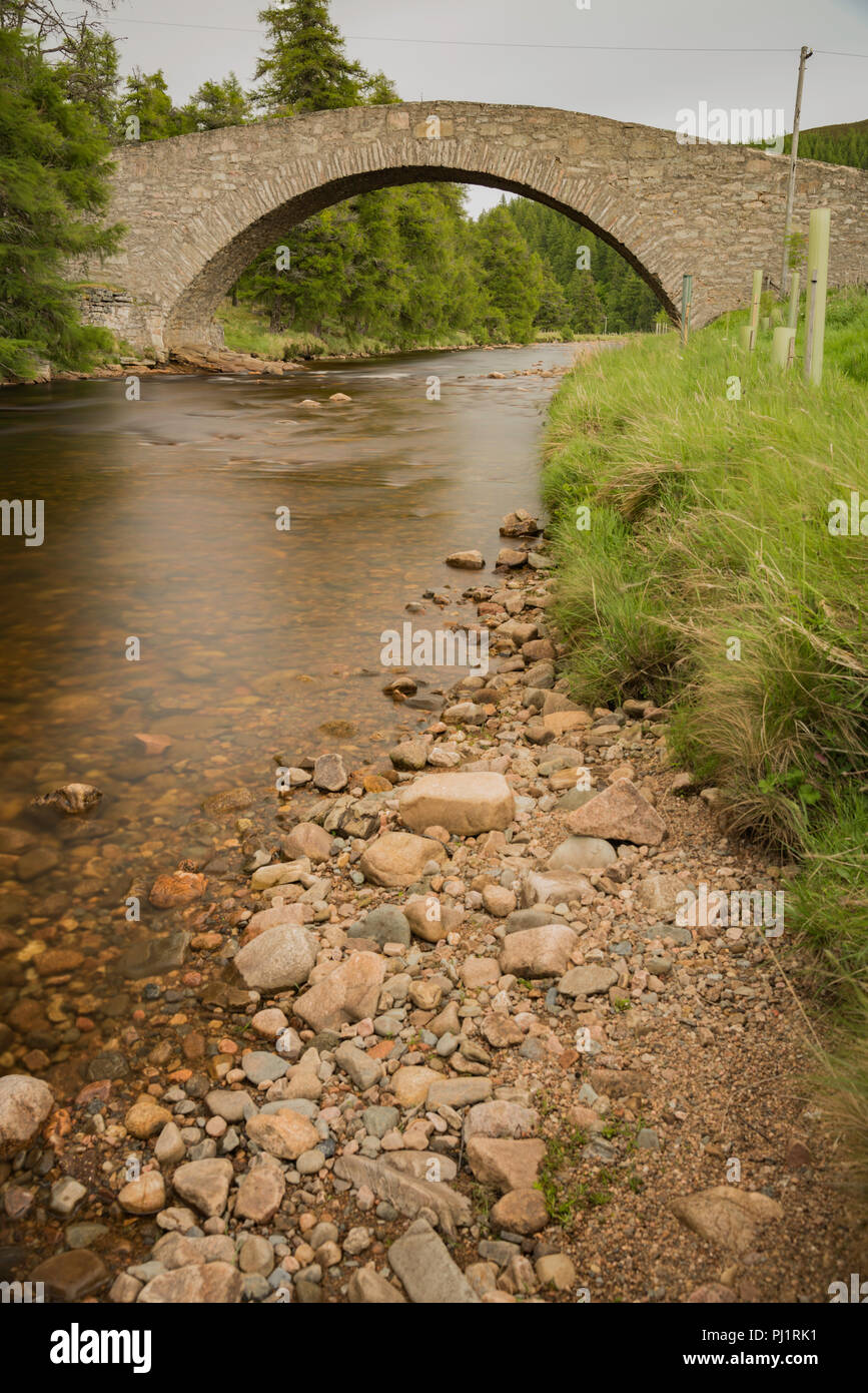 Ancient stone bridge over river in Scotland, UK Stock Photo
