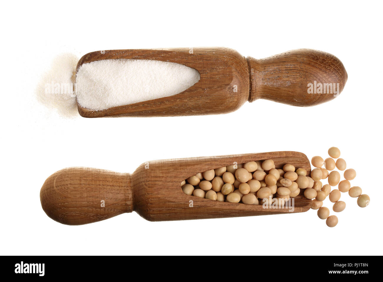 soybeans and dried soy milk in wooden scoop isolated on white