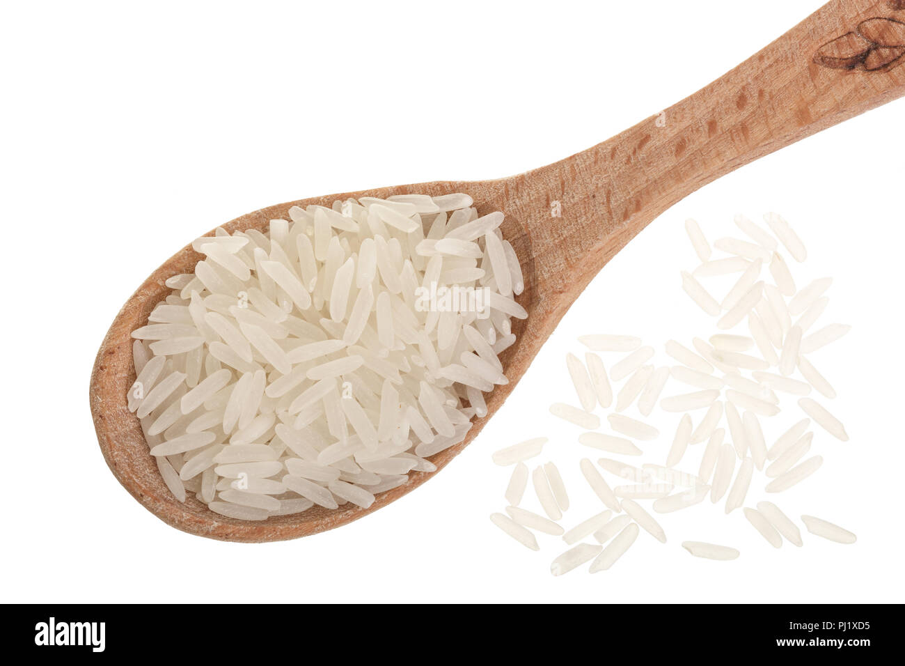 rice grains in wooden spoon isolated on white background. Top view