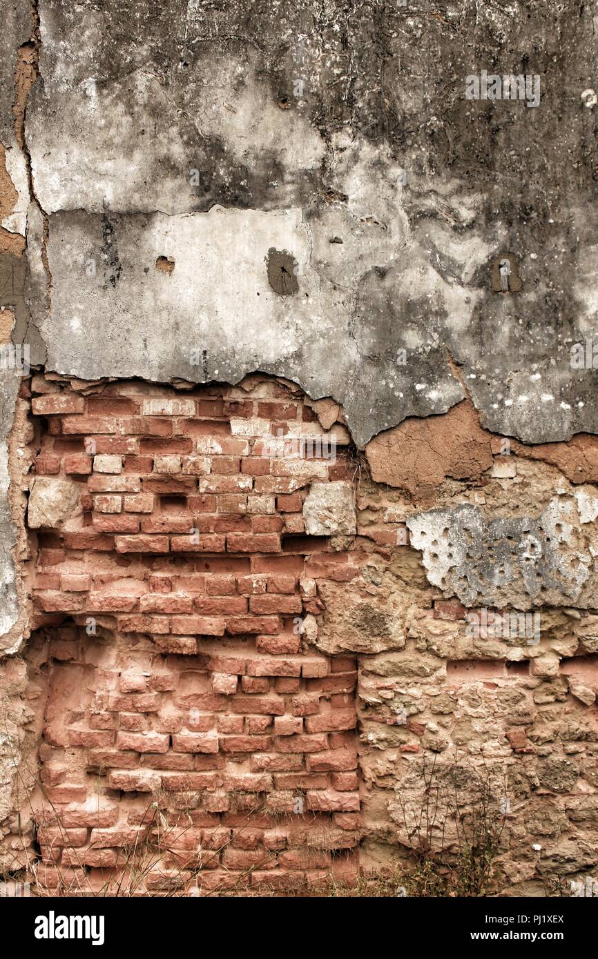 Old and damaged wall texture with old white paint Stock Photo