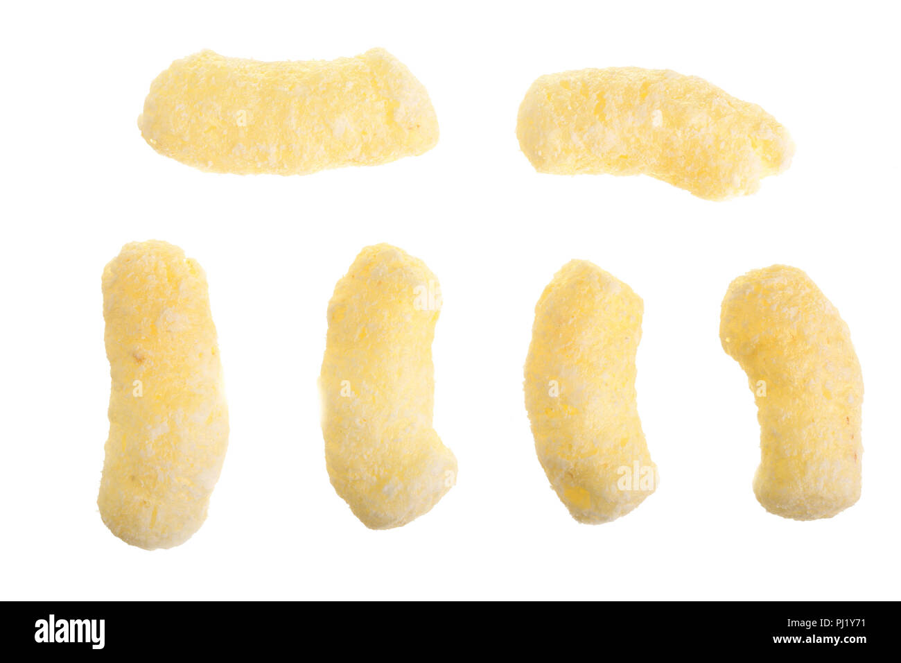 Sweet crunchy corn sticks or snacks isolated on white background. Top view. Flat lay. Stock Photo