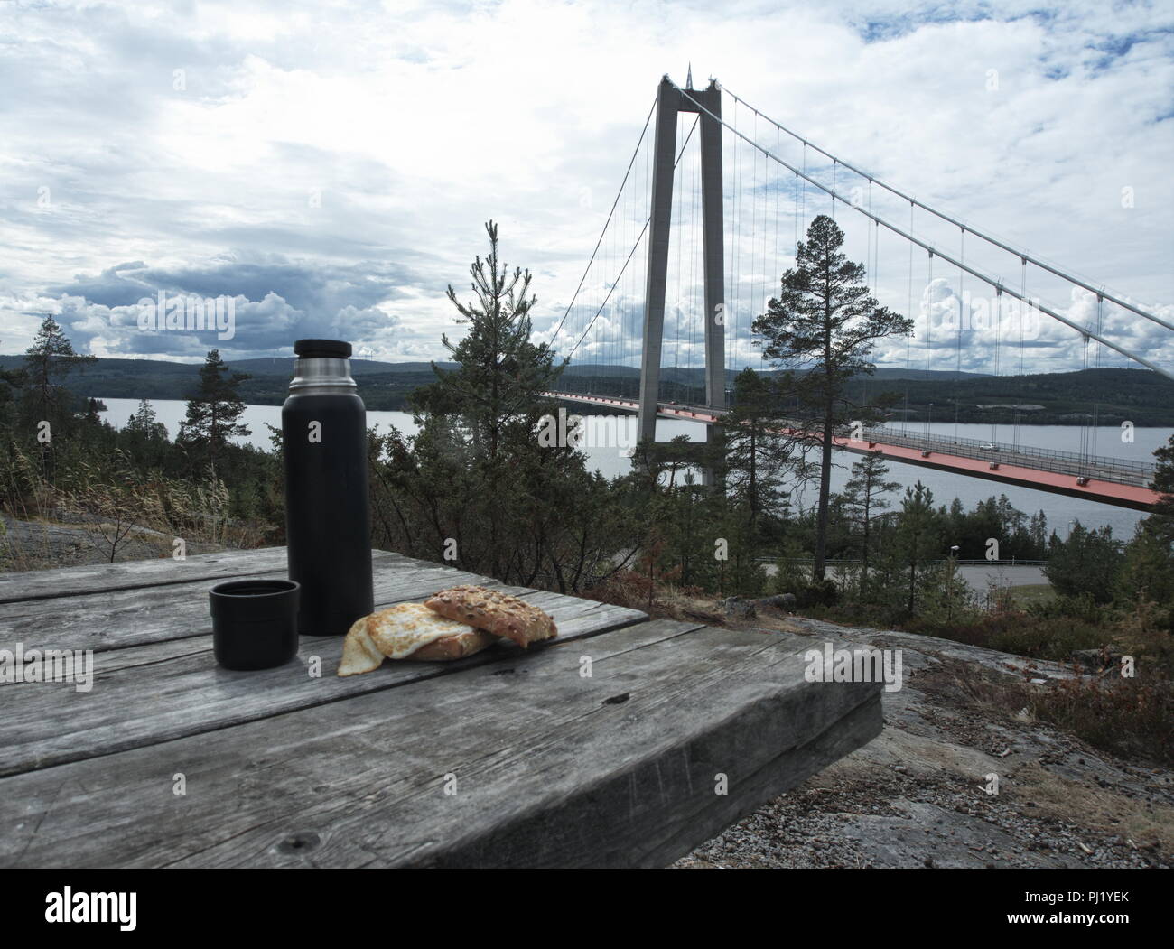 Pause with coffee and sandwich at a swedish bridge. Stock Photo