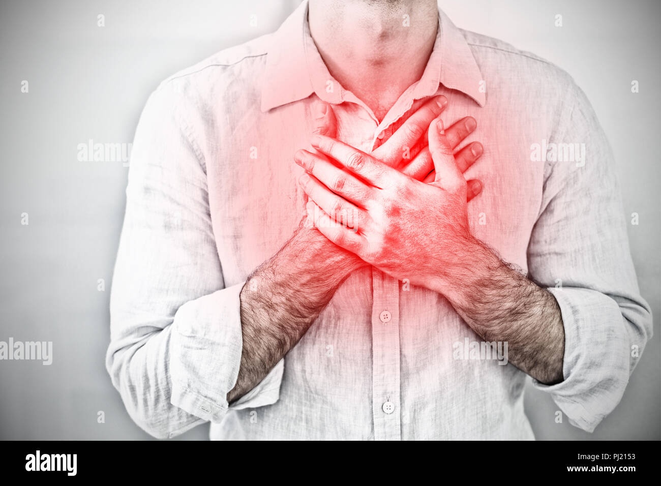 Composite image of mid section of a man with chest pain Stock Photo