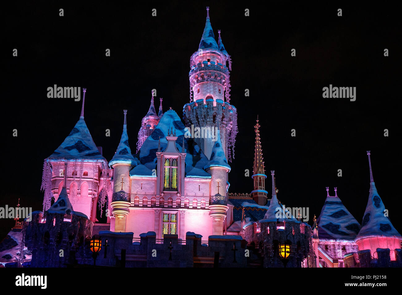 Sleeping Beauty's Castle at night, Disneyland, Anaheim, California, United States of America Stock Photo