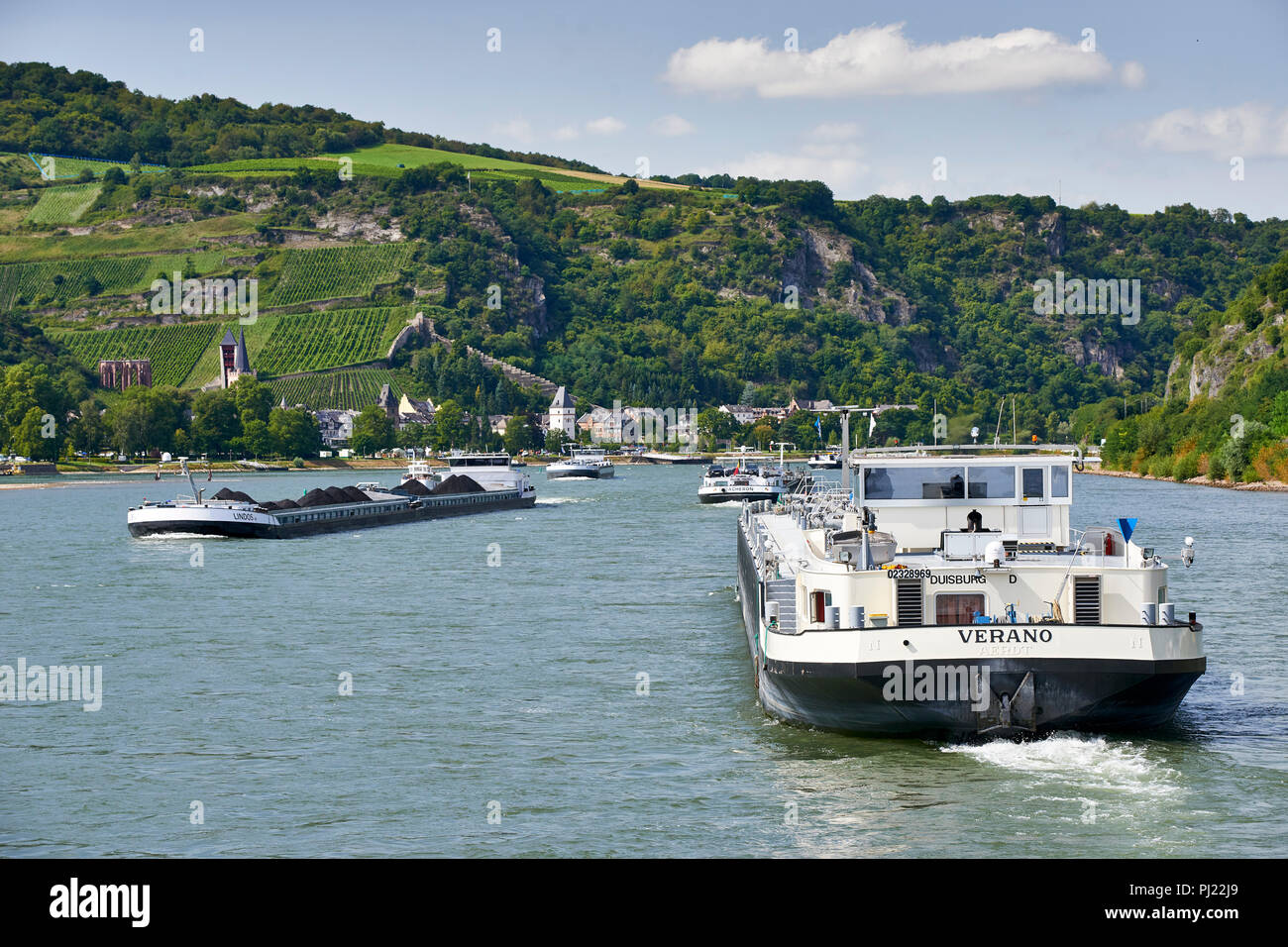 Verano, oil and gas barge travelling on the river Rhine near Lorch, passing the Lindos II coal barge travelling upstream Stock Photo