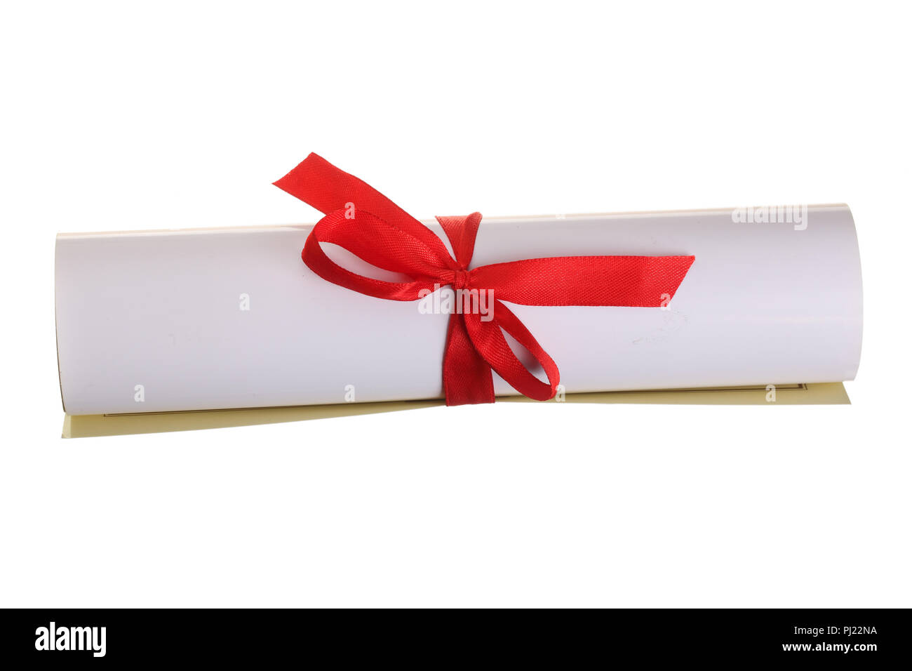 Diploma with red ribbon isolated on white background. Top view. Flat lay. Stock Photo