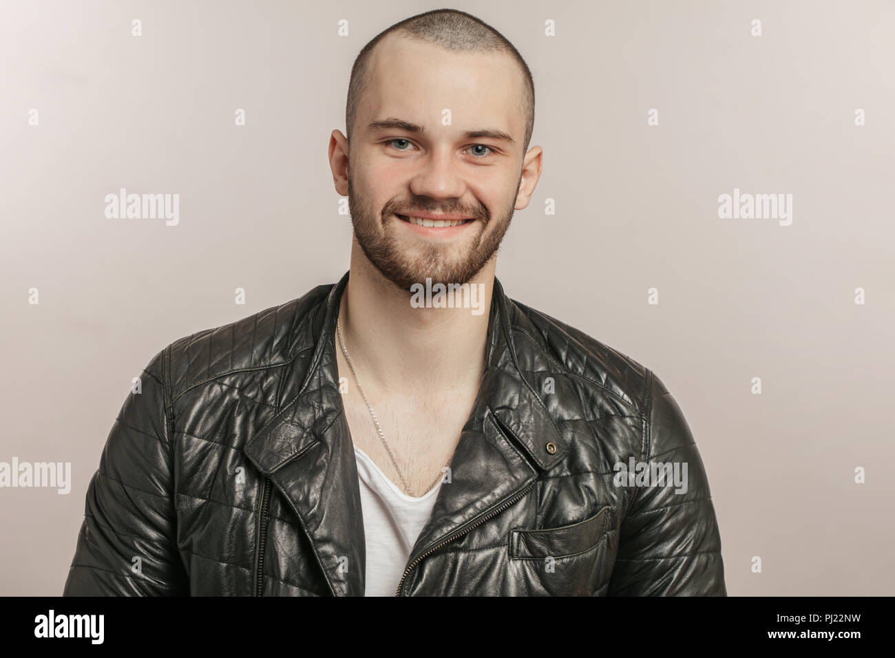 Muscular man in leather jacket hi-res stock photography and images - Alamy