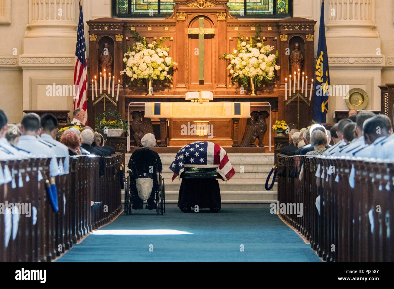 Roberta McCain, sits in a wheelchair next to the flag draped casket of her son, Sen. John McCain, during the memorial service at the United States Naval Academy Chapel September 2, 2018 in Annapolis, Maryland. John S. McCain, III graduated from the United States Naval Academy in 1958. He was a pilot in the United States Navy, a prisoner of war in Vietnam, a Congressmen and Senator and twice presidential candidate. He received numerous awards, including the Silver Star, Legion of Merit, Purple Heart, and Distinguished Flying Cross. Stock Photo
