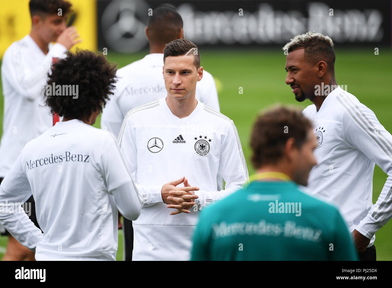 Julian Draxler (Germany) left: Leroy Sane (Germany), Jerome Boateng (Germany), (right). GES/Football/Training of the German national football team in Muenchen, 03.09.2018 Football/Practice German National Football Team, Munich, September 3, 2018 | usage worldwide Stock Photo