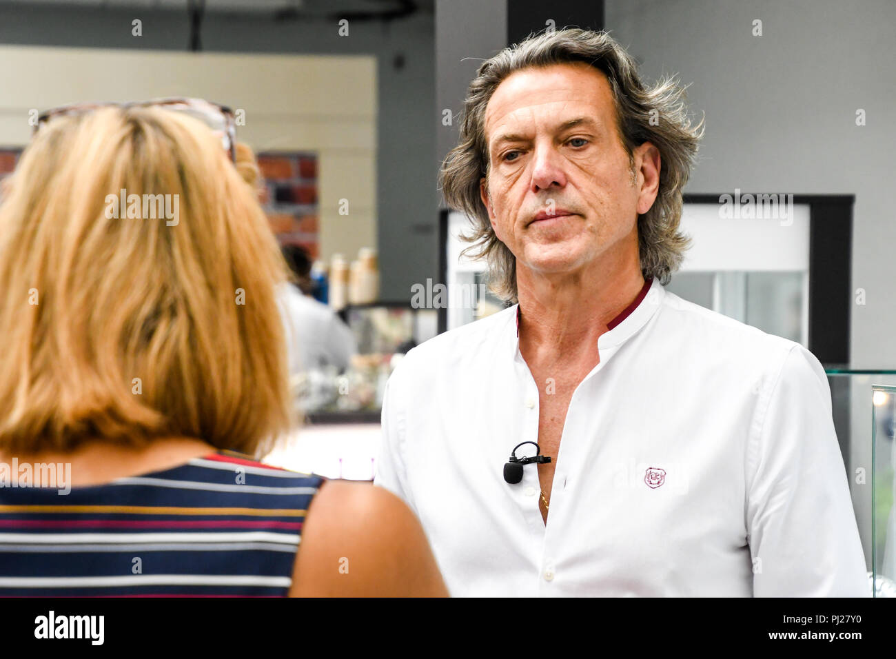 London, UK. 3rd September, 2018. Stephen Webster of Goldsmiths Craft & Design Council interview by reporter at the International Jewellery London 2018, Olympia London, UK. Credit: Picture Capital/Alamy Live News Stock Photo