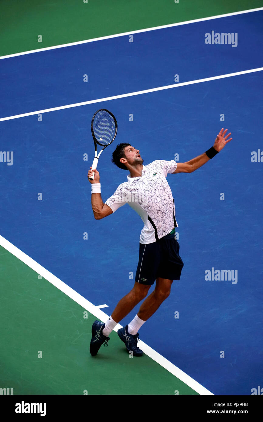 Flushing Meadows, New York - September 3, 2018: US Open Tennis: Number 6  seed Novak Djokovic serving to serving to Joao Sousa of Portugal during  their fourth round match at the US