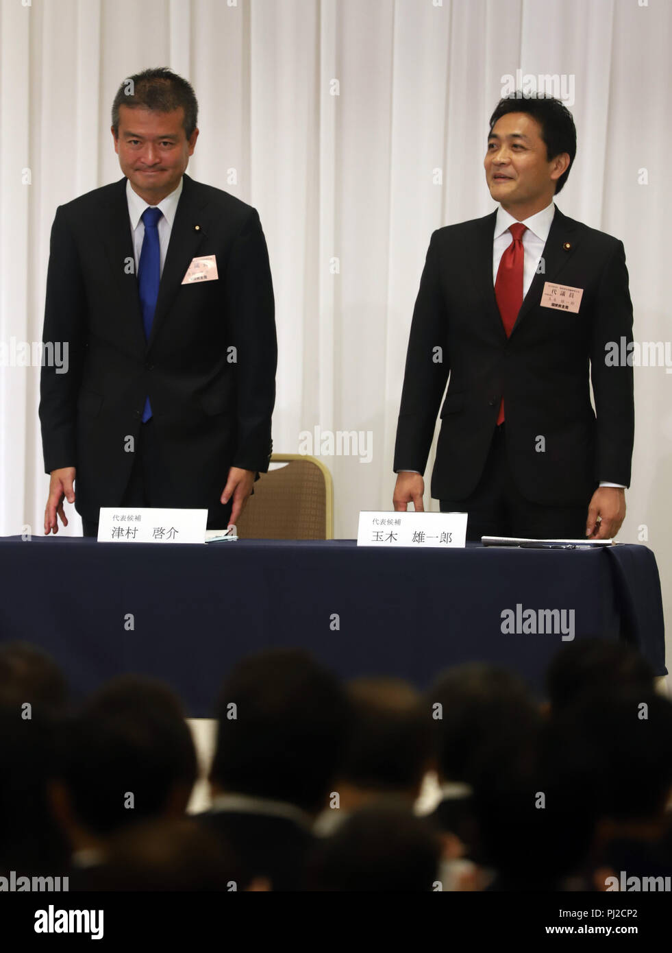 Tokyo, Japan. 4th Sep, 2018. Japan's second largest opposition Democratic Party for the People new president Yuichiro Tamaki (L) and another candidate Keisuke Tsumura (R) react as Tamaki was elected for the party leader at the party convention in Tokyo on Tuesday, September 4, 2018. The Democratic Party for the People was formed in May as merger of Democratic Party of Japan and Party of Hope. Credit: Yoshio Tsunoda/AFLO/Alamy Live News Stock Photo