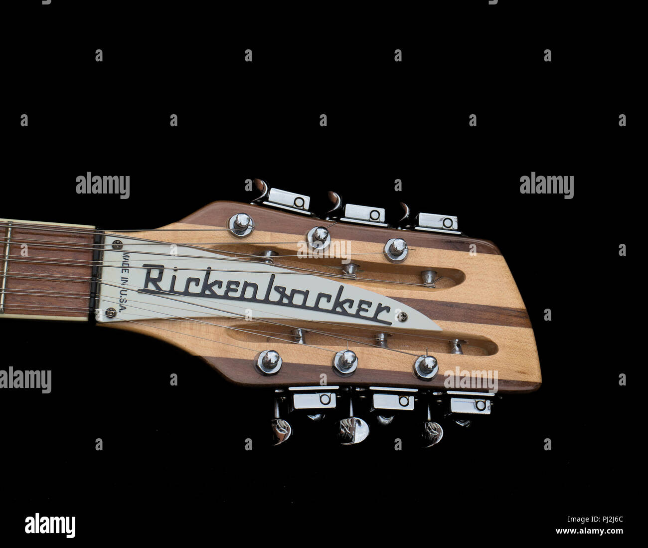 Headstock and pegs of a  Rickenbacker 360-12 Twelve String. Color Maple Glow. USA.1985 Stock Photo