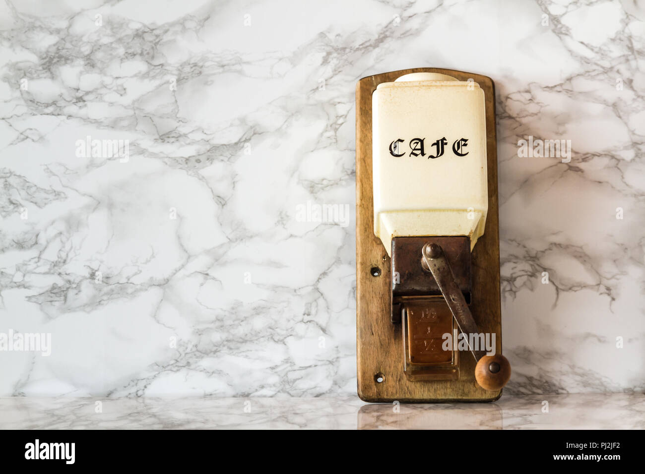 Old manual wooden coffee grinder machine Stock Photo