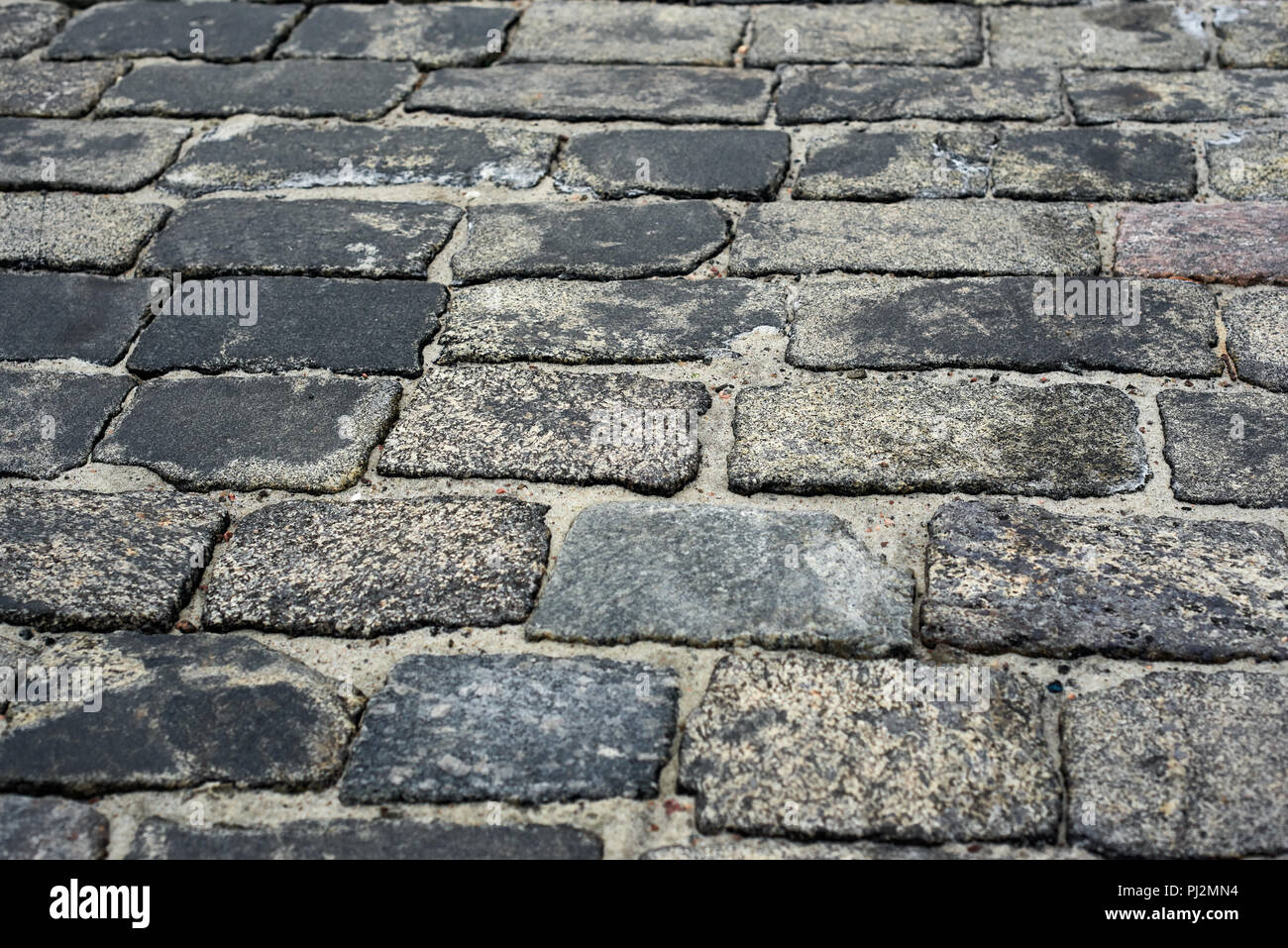 old cobblestone road for background or texture Stock Photo - Alamy