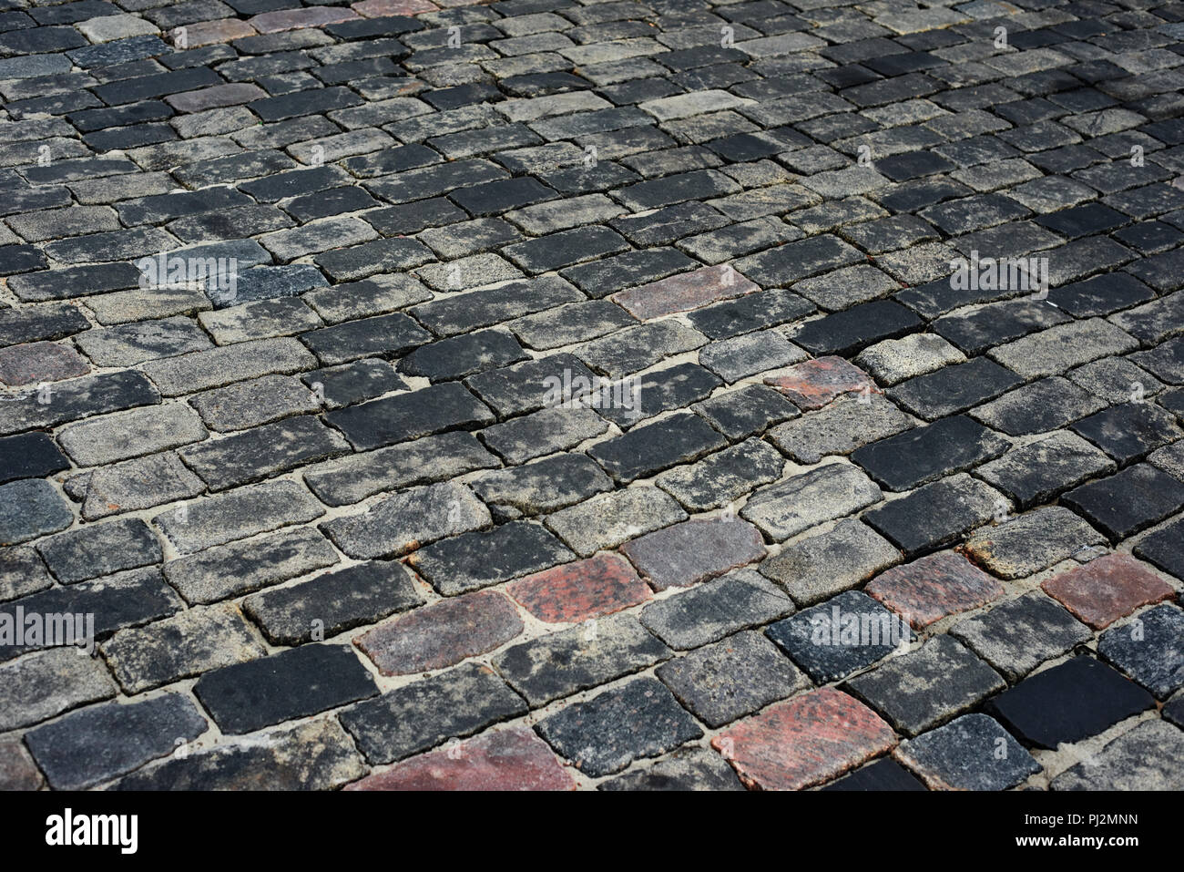old cobblestone road for background or texture Stock Photo - Alamy