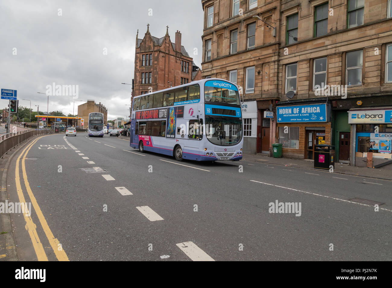 A First Glasgow double decker bus on Eglinton Street in Glasgow heading  towards the city centre Stock Photo